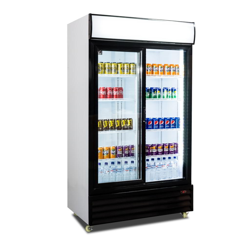 Angled view of a retail display fridge, the right sliding door is opened. Populated with beverages, all lighting is turned on